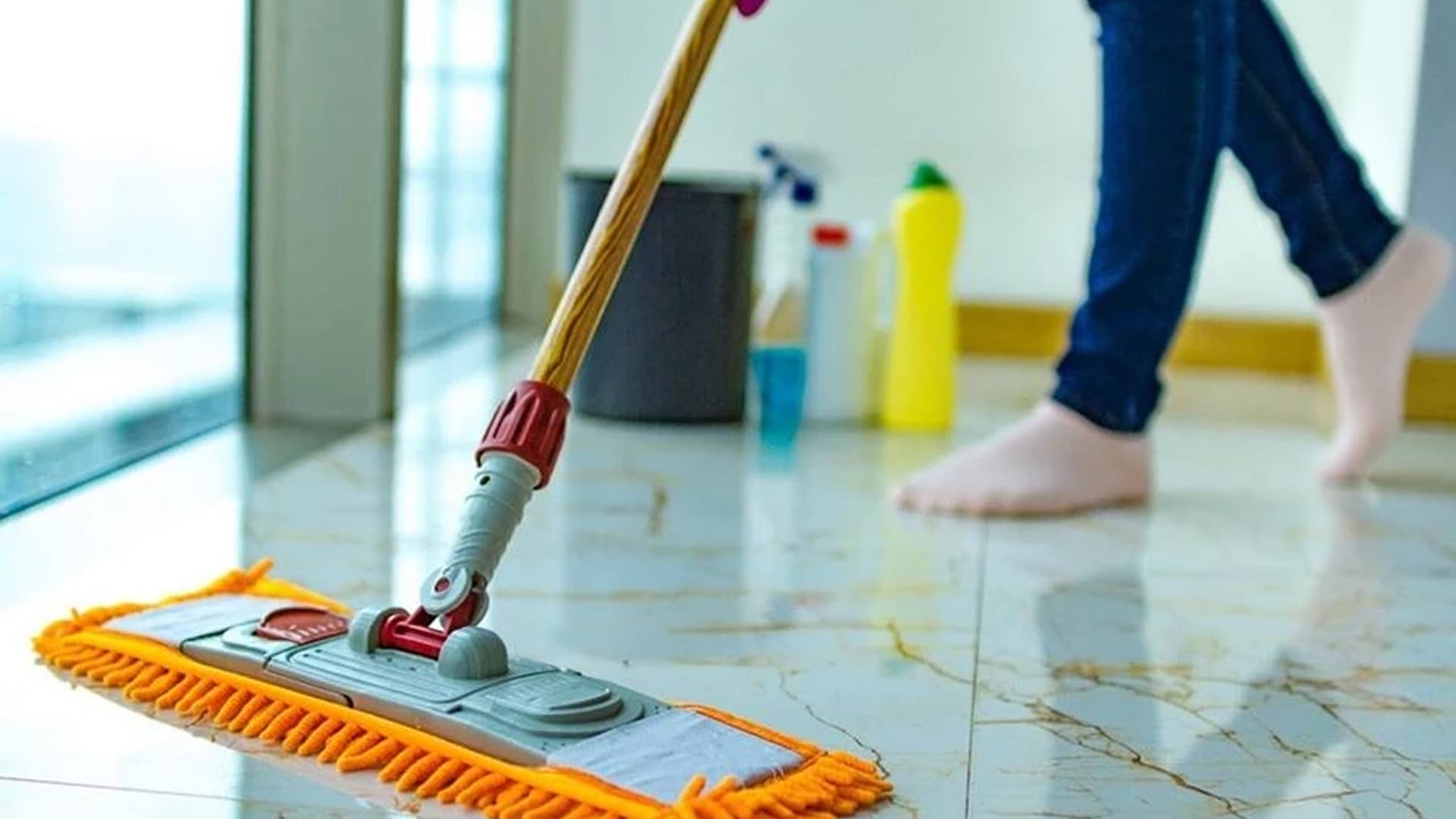 Technician deep cleaning a marble countertop