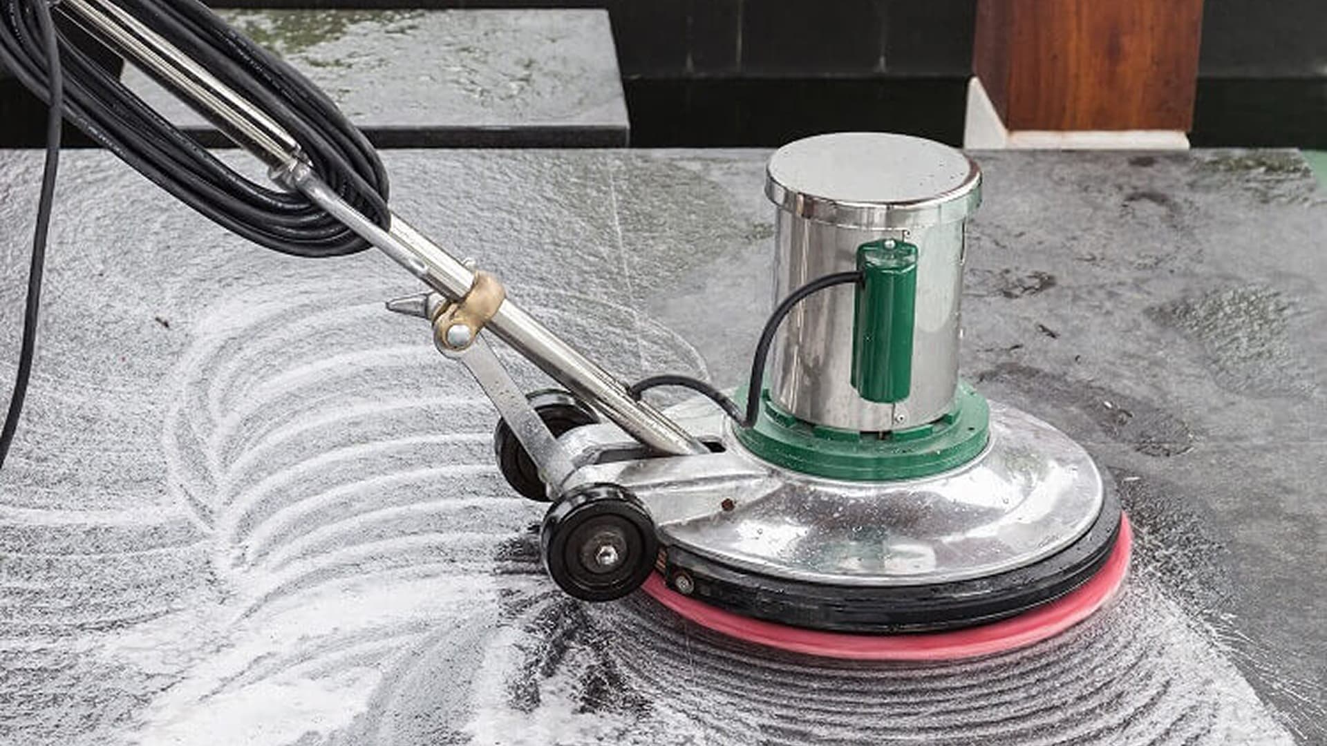 Diamond abrasive pads on a marble floor during polishing