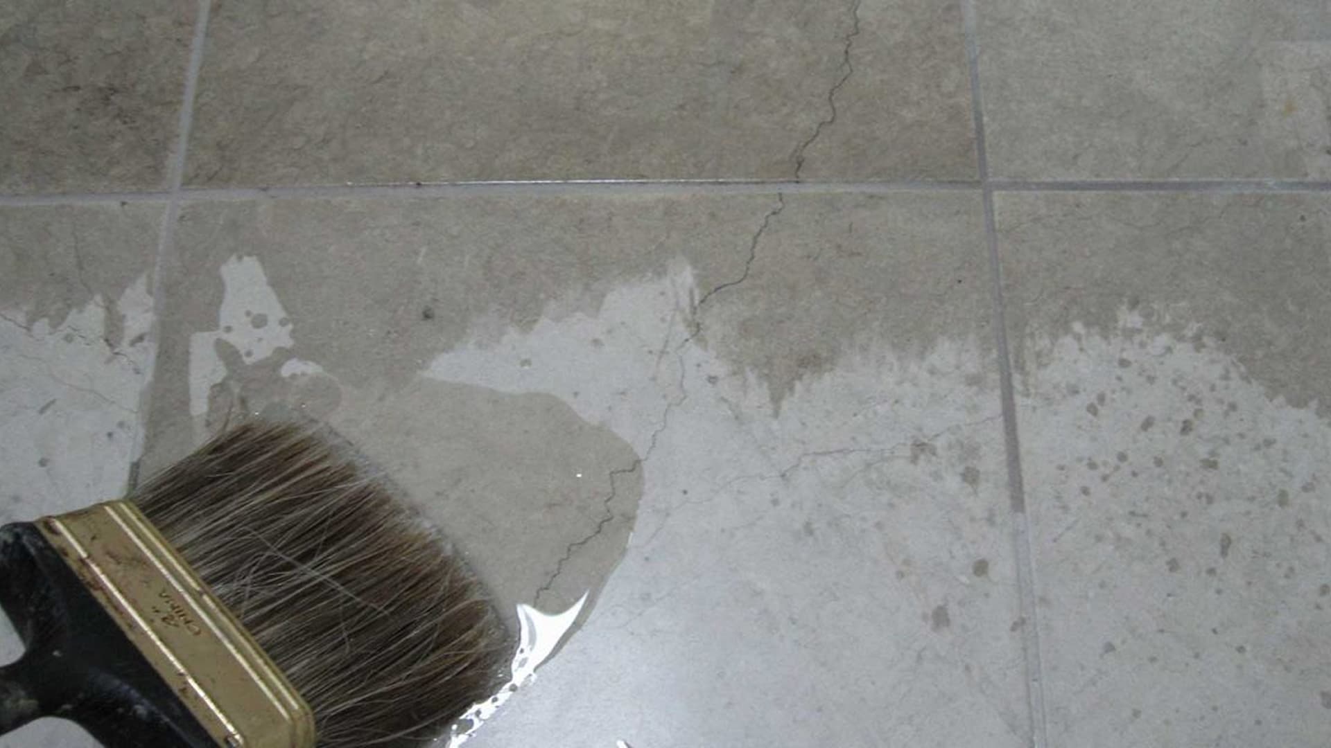 Water beading on a sealed marble surface