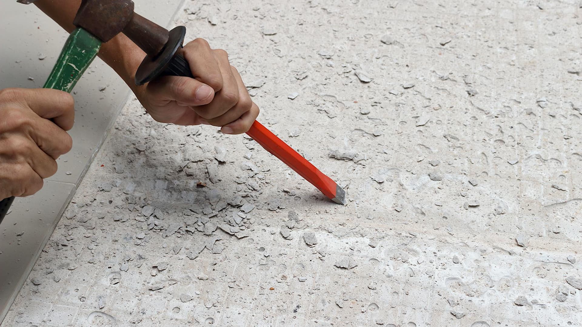Terrazzo floor showing carpet tack‑strip holes before and after repair